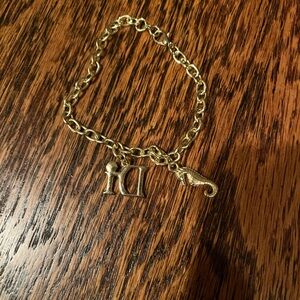 Gold tone seahorse charm bracelet